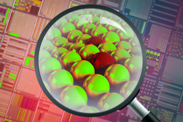 A magnifying glass seeing into a semiconductor and finding atoms, which look like smooth spheres but some are cracked and brittle.