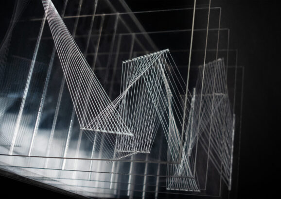 A layered sculpture resembling zig-zag patterns and geometric shapes