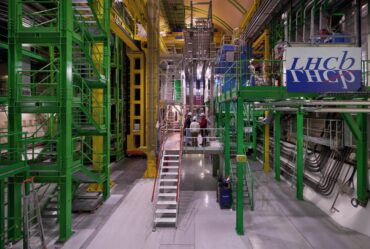 Image of the The LHCb experiment, a large assemblage of metal scaffolding and pipes in bright colors