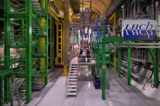 Image of the The LHCb experiment, a large assemblage of metal scaffolding and pipes in bright colors