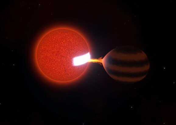 A red sphere, left, sucks energy out of a brown sphere, causing a patch on the red sphere to glow white hot.